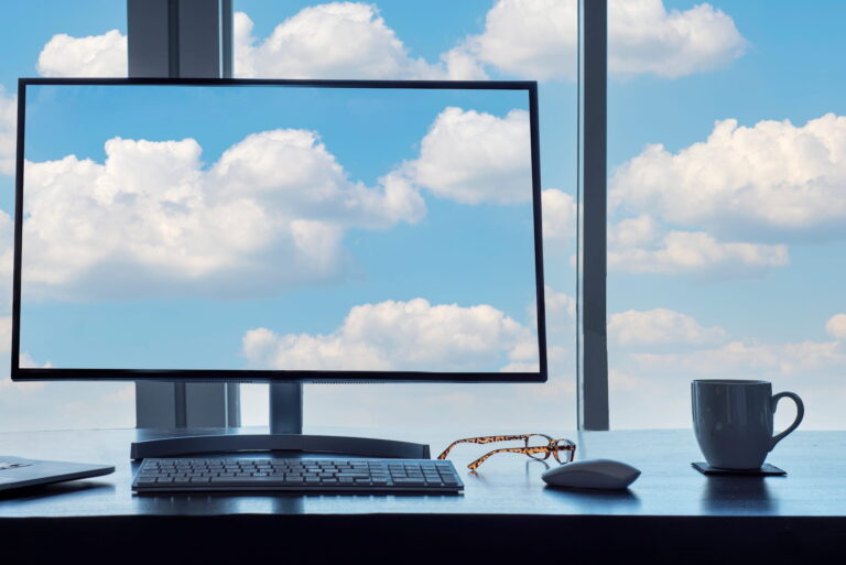 Conceptual cloud computing desk with computer keyb m92ze57