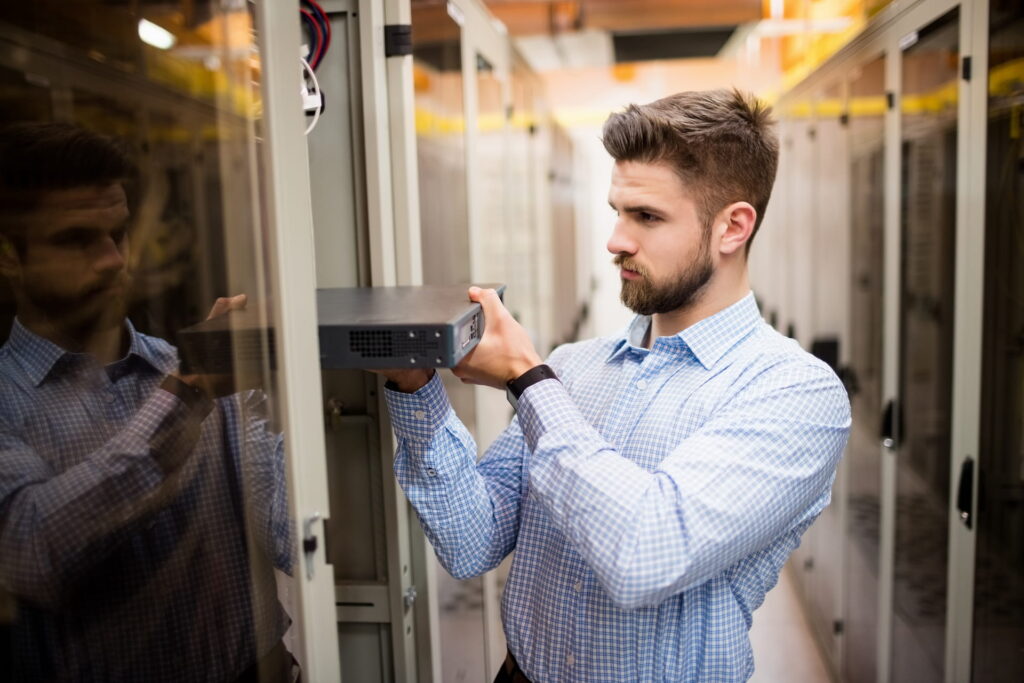 Technician Removing Server From Rack Mounted Serve H9t5bxz Copy